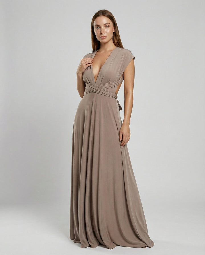 Female wearing a long multiway wrap maxi dress on a plain background.