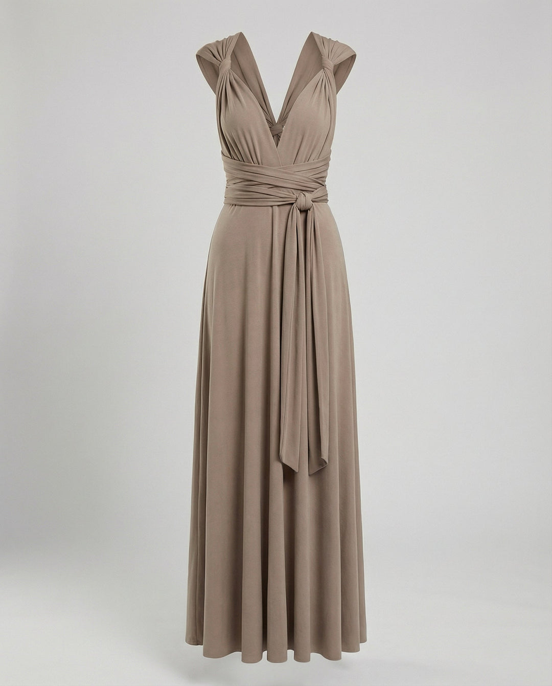 Flowing wrap-style evening dress against a plain background.