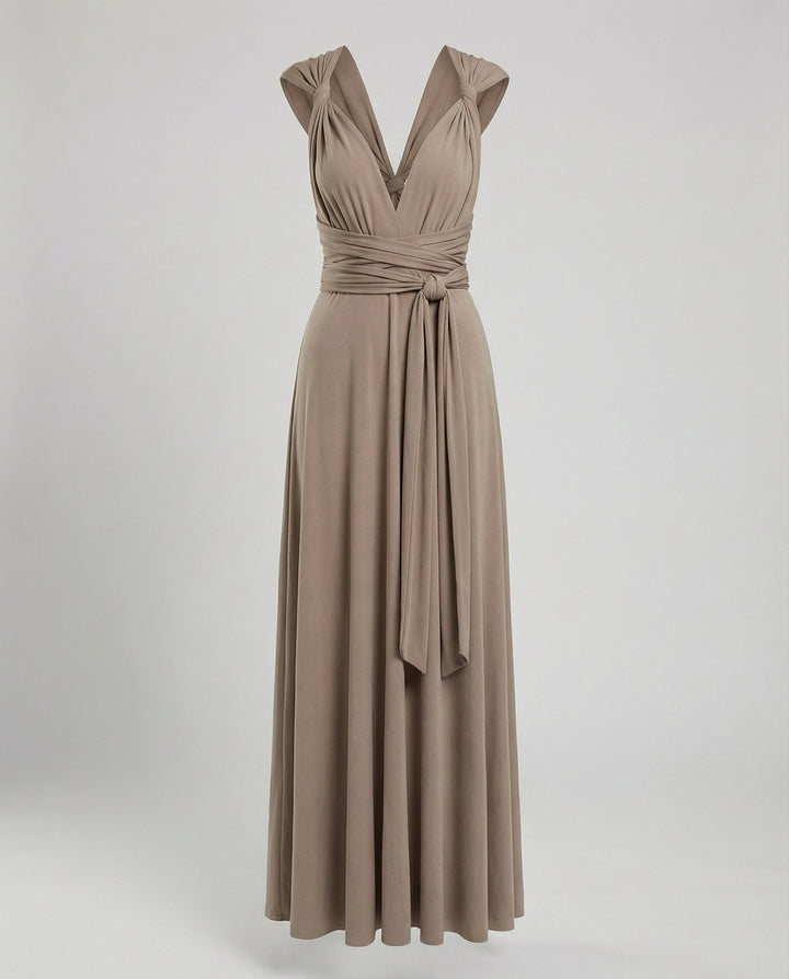 Flowing wrap-style evening dress against a plain background.