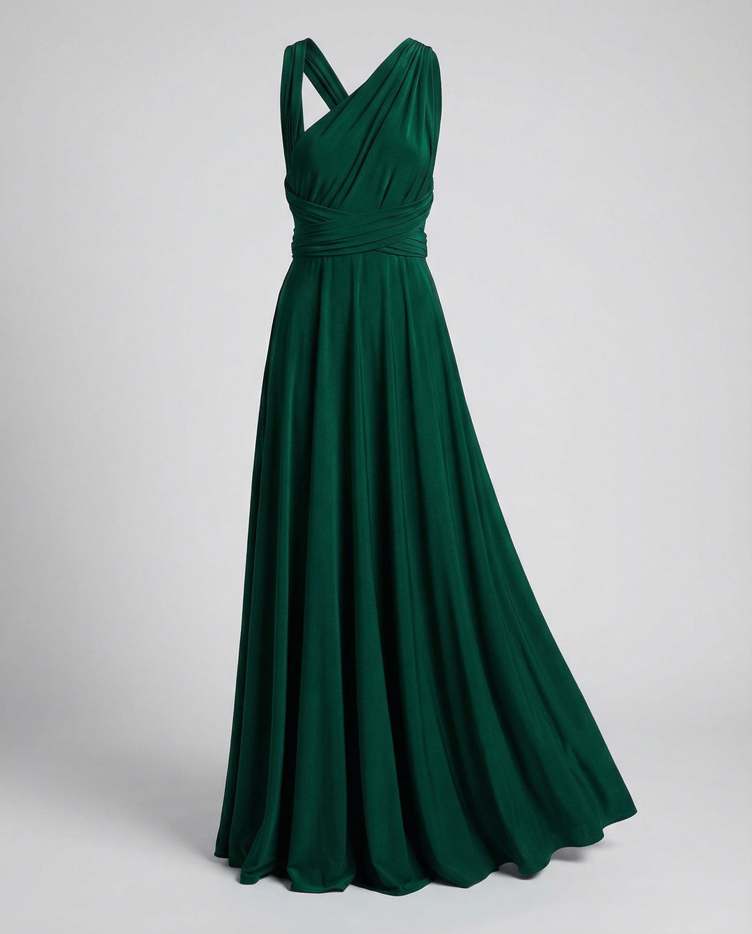 Versatile wrap dress with long fabric ties on a plain background.
