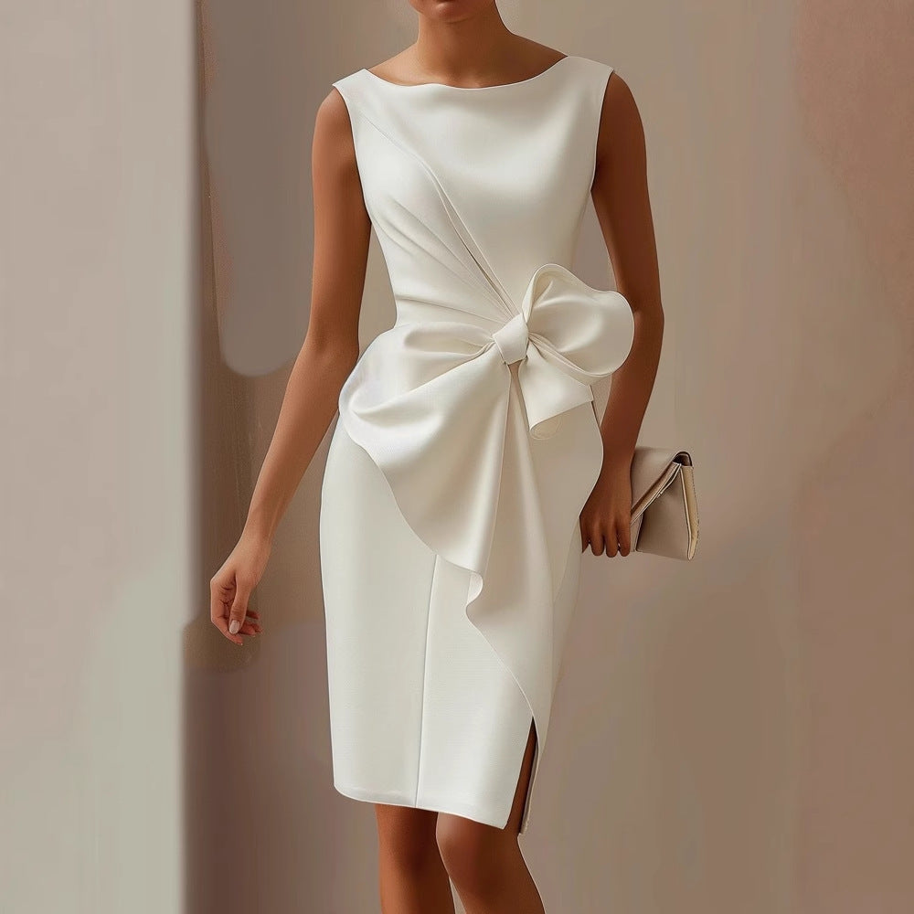 Woman posing in a fitted sleeveless midi dress with draped skirt styling on a plain background.