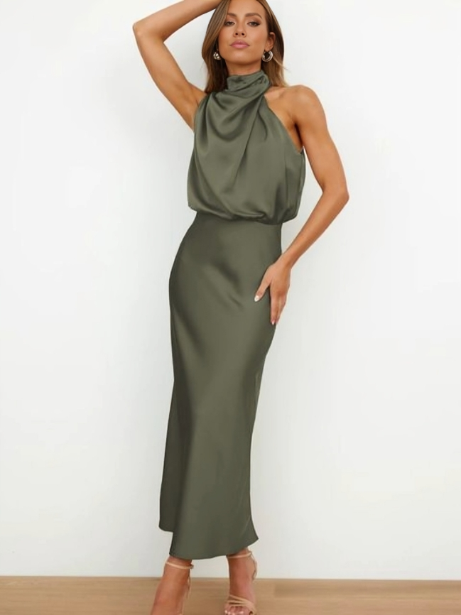 Female model displaying an easy-to-style outfit with soft movement on a plain background.