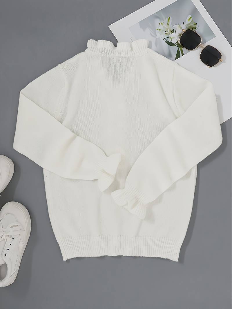 Long sleeve blouse with soft ruffle accents on a plain background.