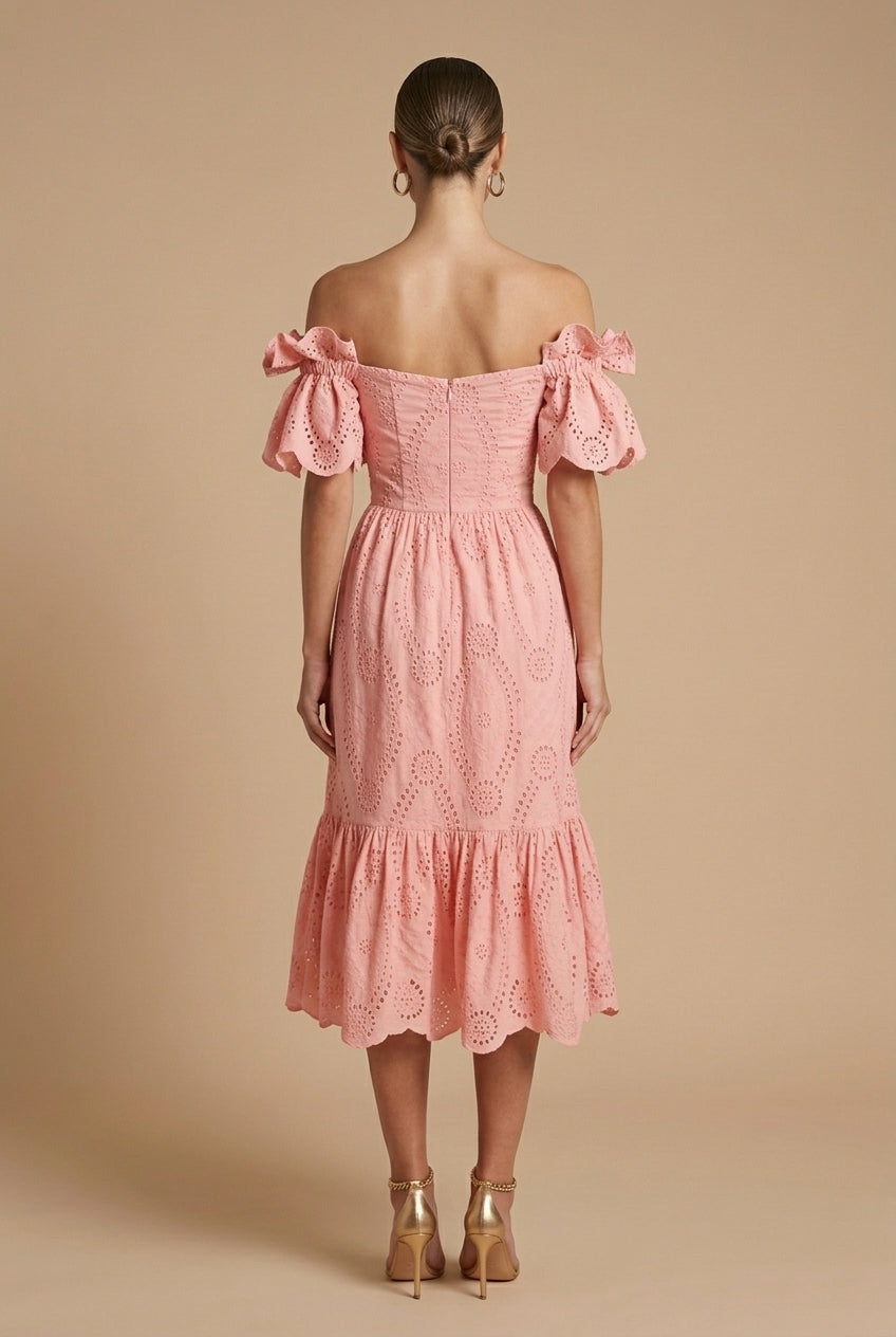  Female model showcasing a tailored-inspired dress with a refined silhouette on a plain background.
