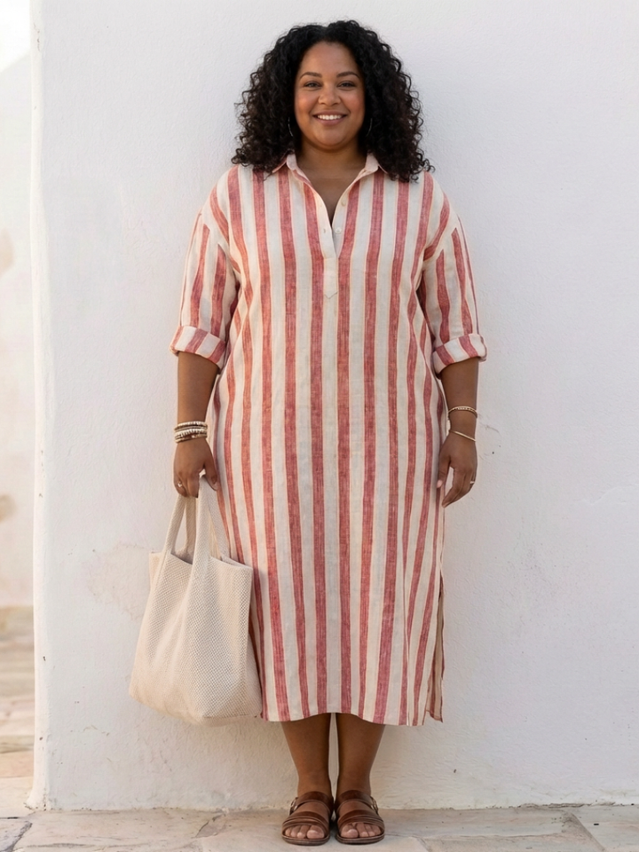 Woman wearing a graceful formal layer with clean lines on a plain background.