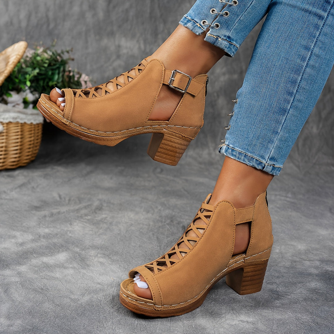 Woman modelling casual sandals with breathable construction against a plain background.
