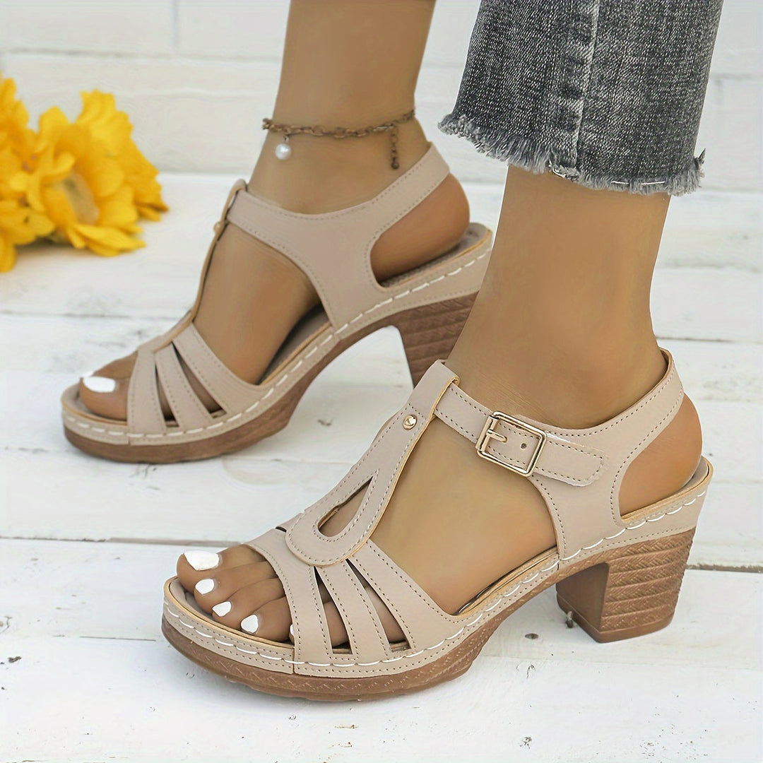 Female wearing casual buckle sandals with a comfortable footbed.
