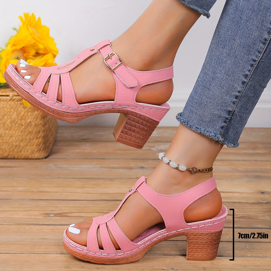 Female modelling cushioned sandals with buckle strap detailing.