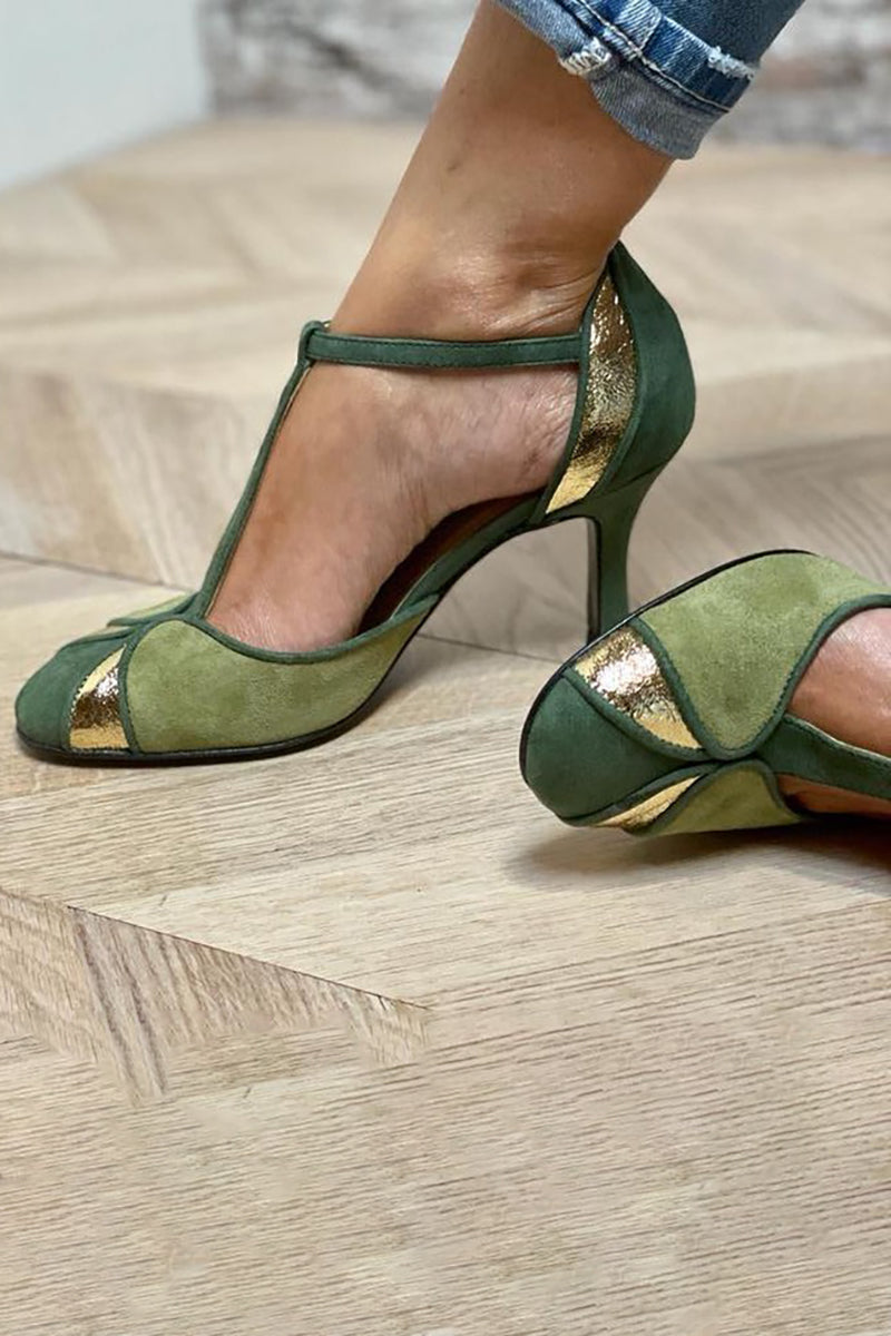 Bright green statement heels with textured patchwork and slim strap detail.