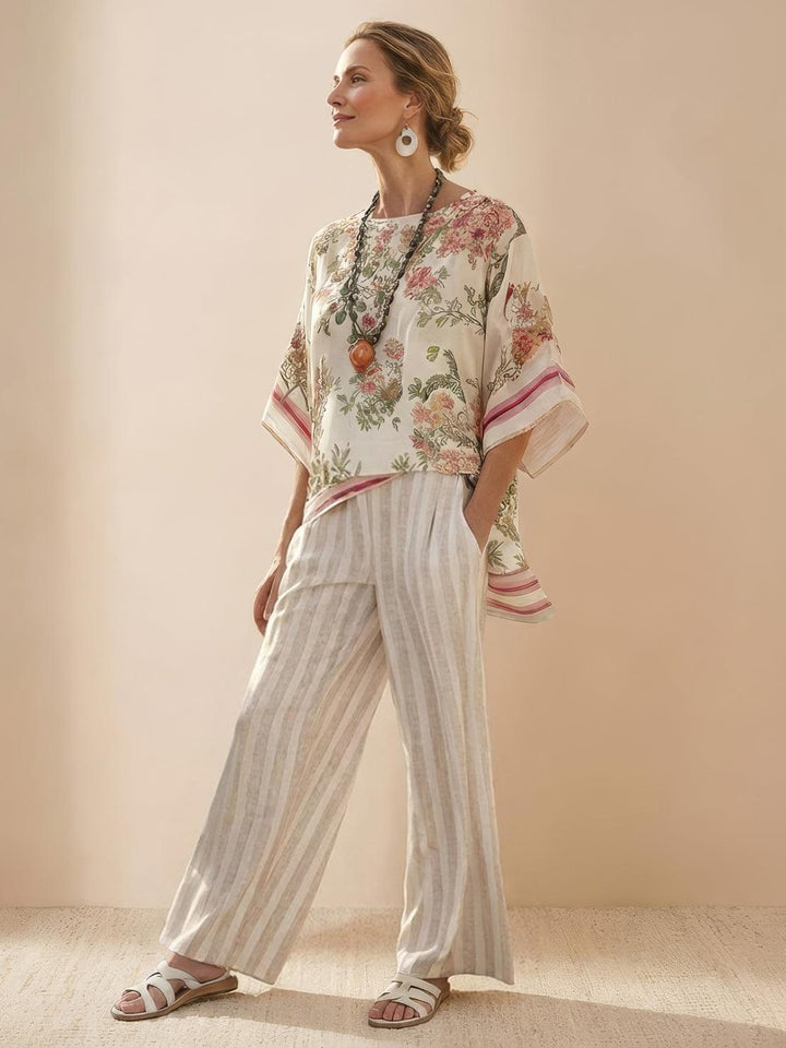 Female model in a striped tunic top and matching wide-leg trousers against a plain backdrop