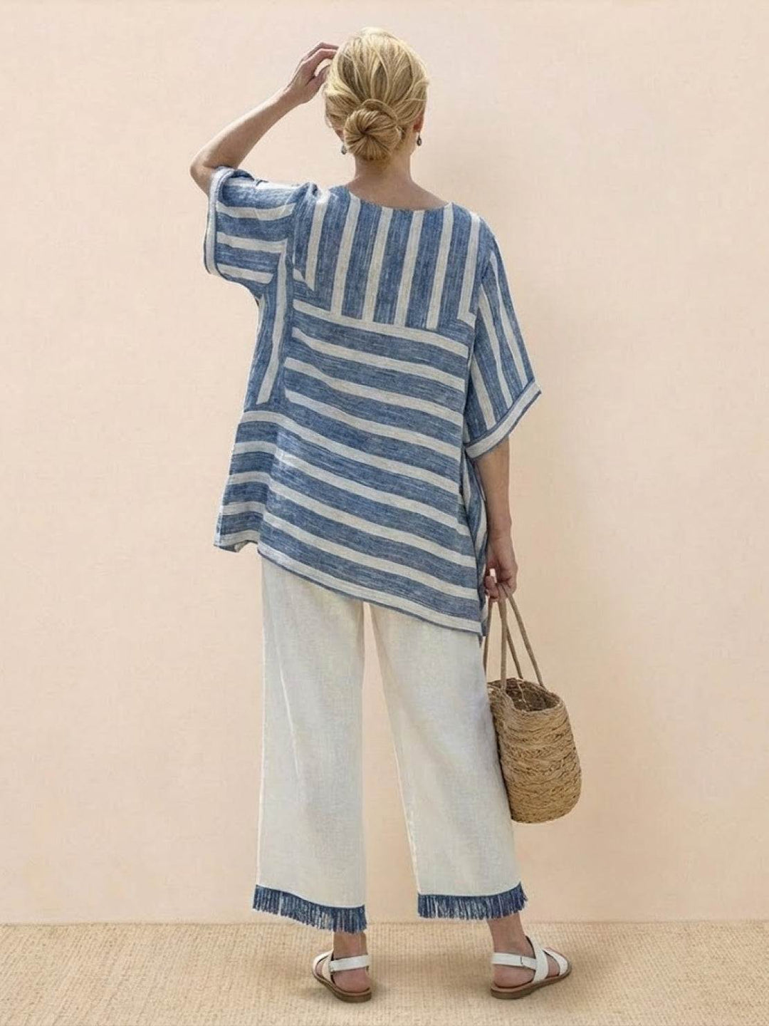 Female model showcasing a relaxed embroidered outfit