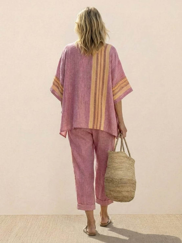 Female model showcasing a relaxed-fit two-piece outfit with embroidered trim details.