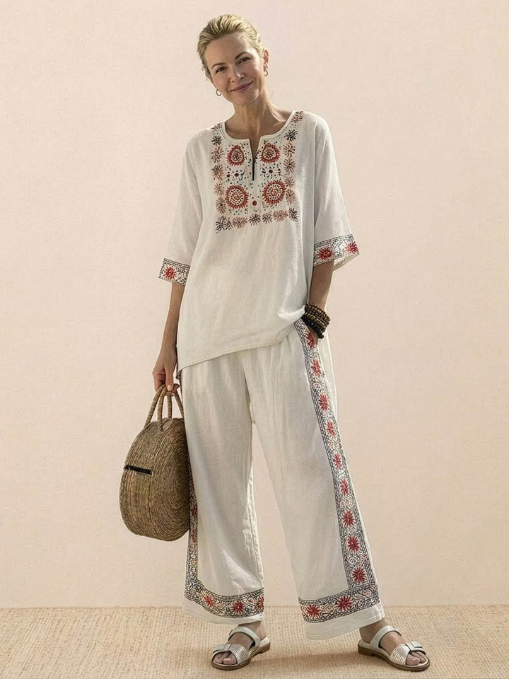 Female model showcasing an embroidered tunic and matching trousers with a relaxed silhouette.