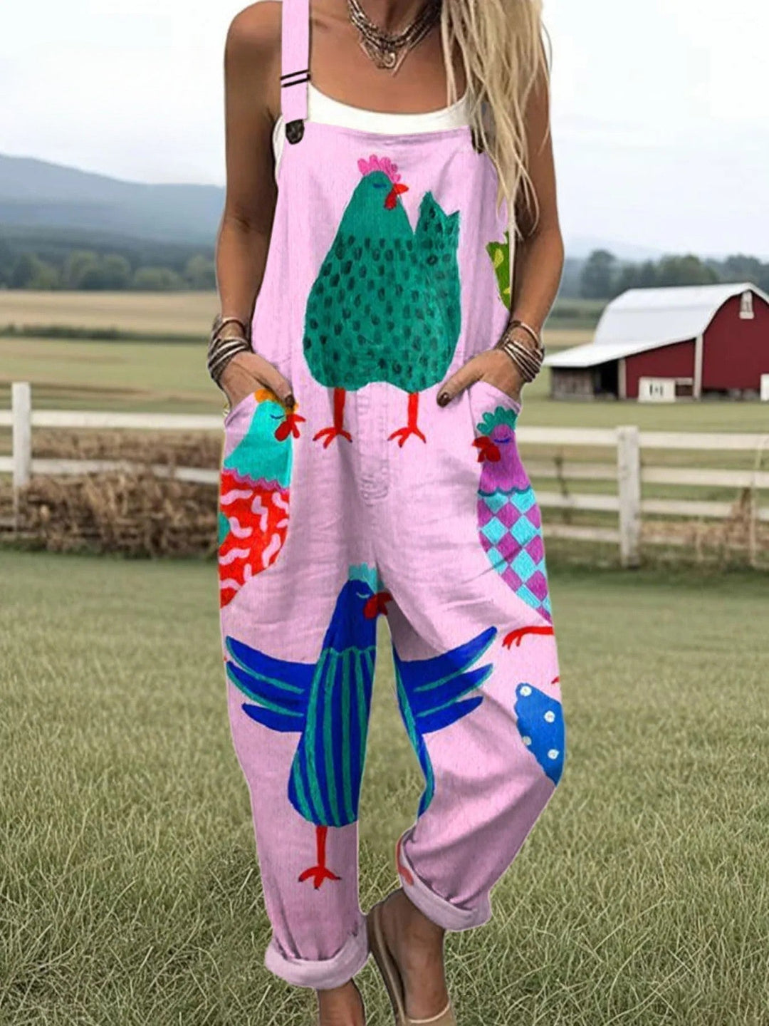 Female wearing a relaxed one-piece outfit on a plain background.