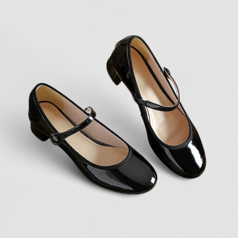Classic low-profile women’s shoes on a plain background.