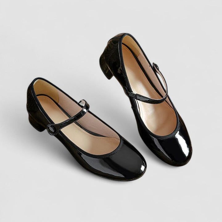 Classic low-profile women’s shoes on a plain background.