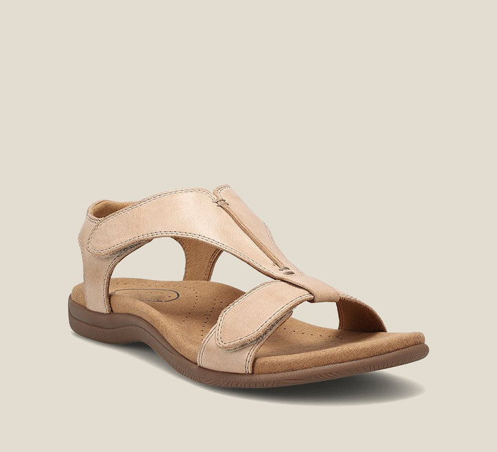 Standing in lightweight open-toe sandals on a plain background.