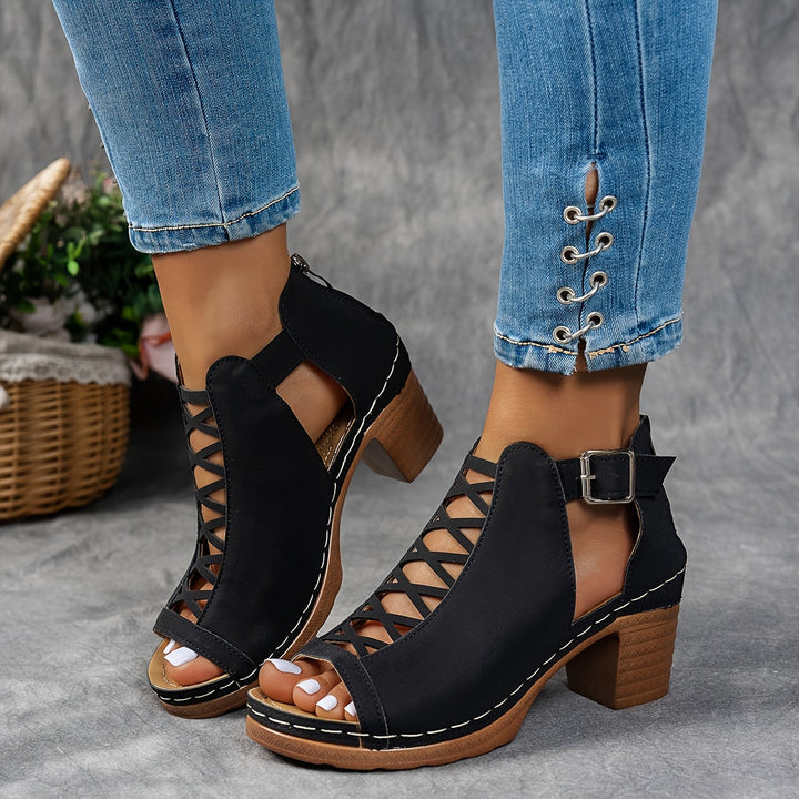 Female modelling lightweight sandals with adjustable straps on a plain background.
