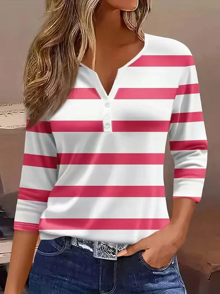  Female in a V-neck striped top with a comfortable everyday silhouette.