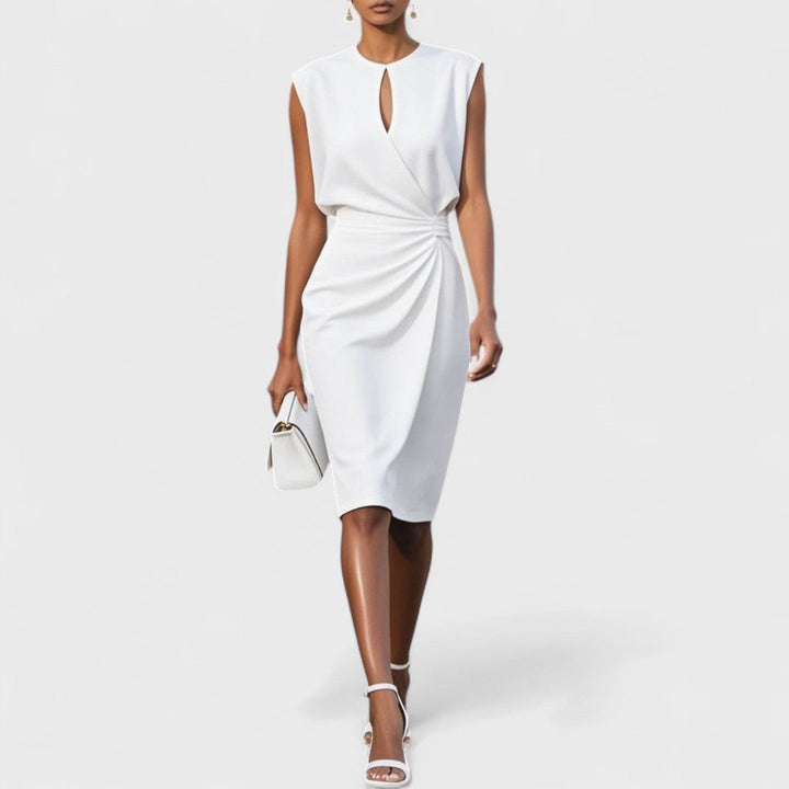  Woman showcasing a formal dress designed for special occasions on a plain background.