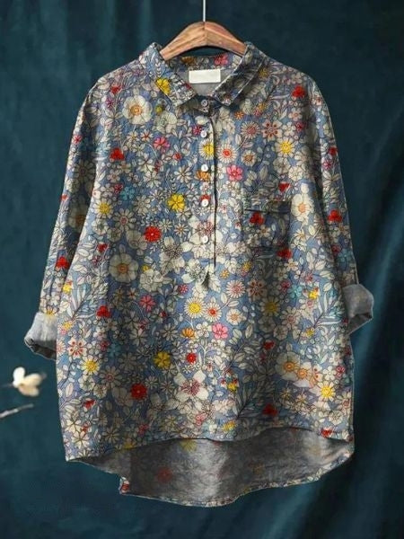 A long-sleeve floral blouse featuring a relaxed and graceful fit.