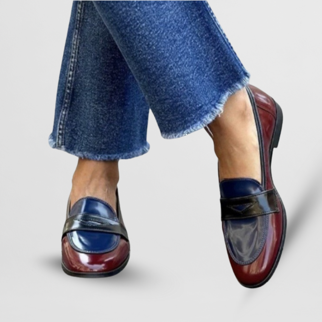 Female model showcasing classic loafers with a polished everyday look.