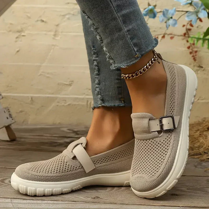 Woman wearing Mary Jane shoes against a plain background for a clean everyday style look.