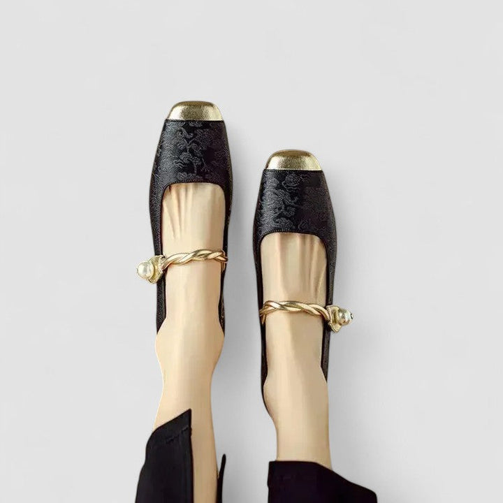 Woman wearing lightweight Mary Jane style shoes on a plain background.