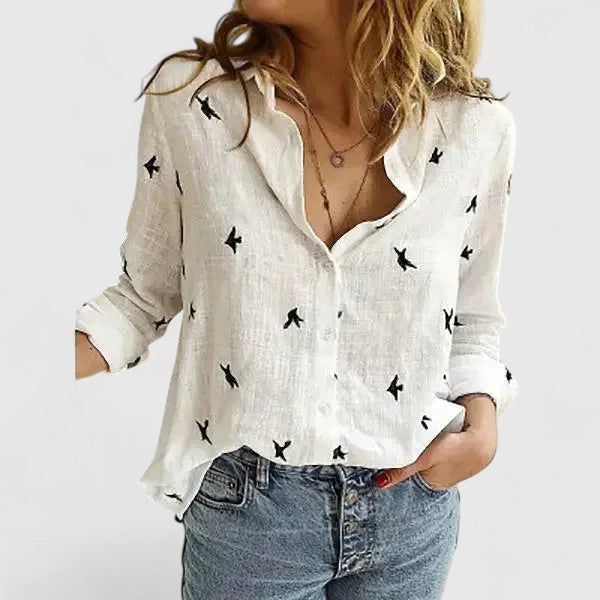  Female in a casual long sleeve shirt with a straight relaxed fit.
