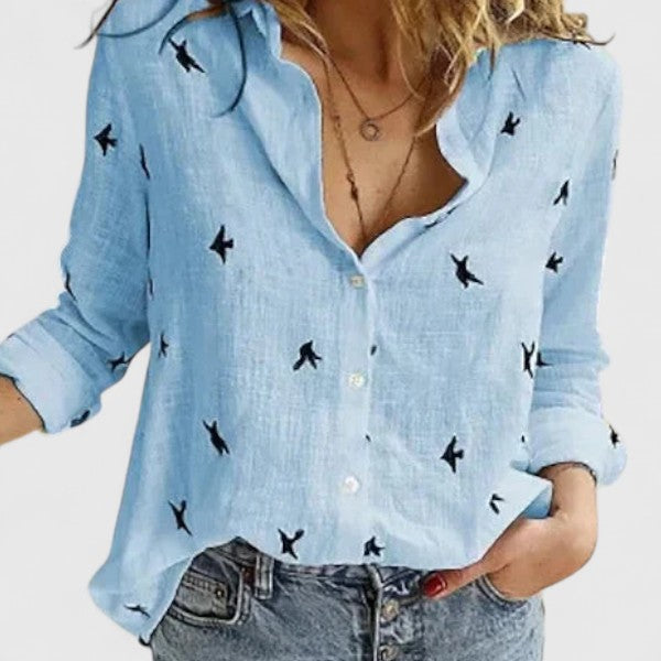  Woman modelling a collared shirt with a clean button-front design.