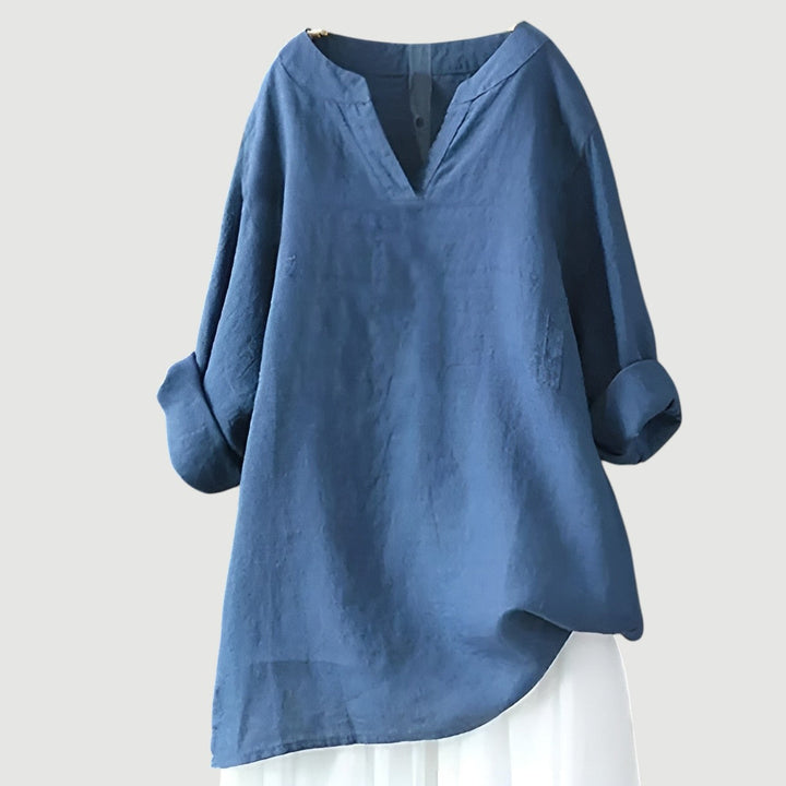 A relaxed sleeveless top with a flowing silhouette against a plain background.