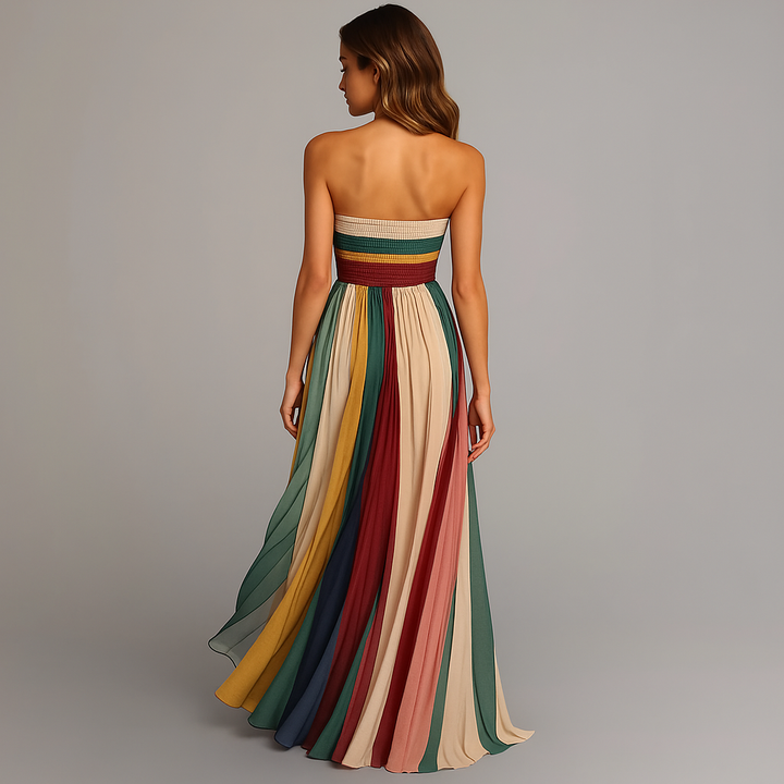 Woman in a strapless maxi dress featuring a wide flowing skirt silhouette.