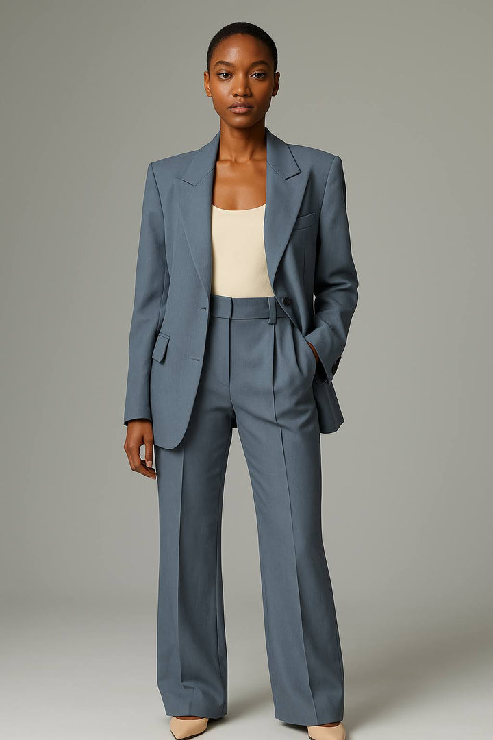Female in a two-piece trouser suit with clean structured lines.