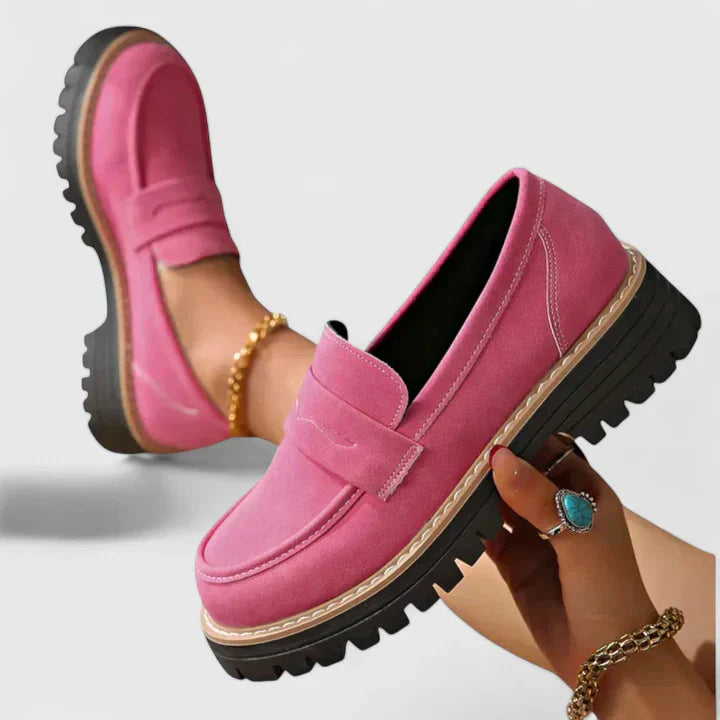 Female loafers displayed on a plain background with a polished casual look.