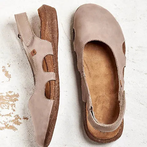Casual walking sandals on a plain background.