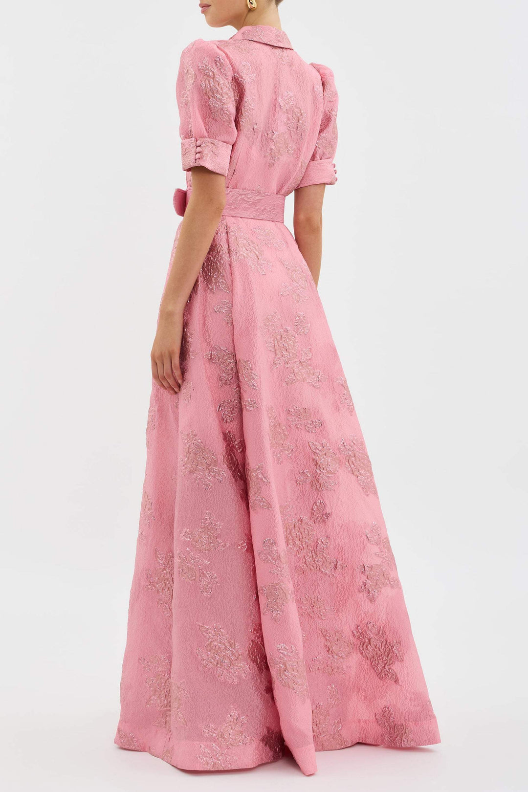  Woman modelling a vintage-inspired midi dress with a defined waist.
