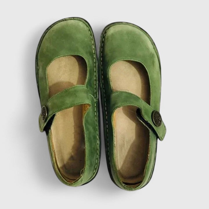 Polished low-profile shoes on a plain background.