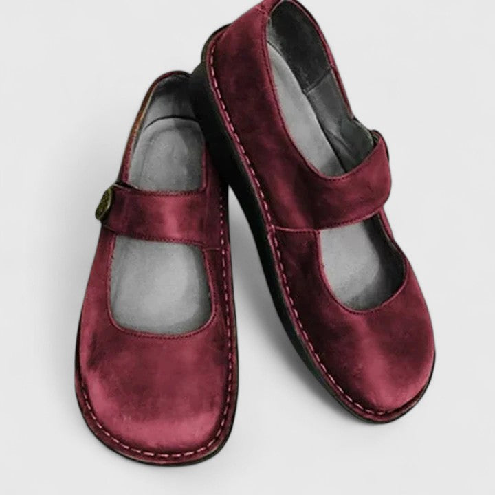 Elegant cushioned shoes on a plain background.