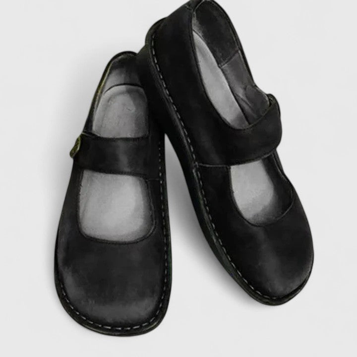 Versatile slip-on shoes on a plain background.