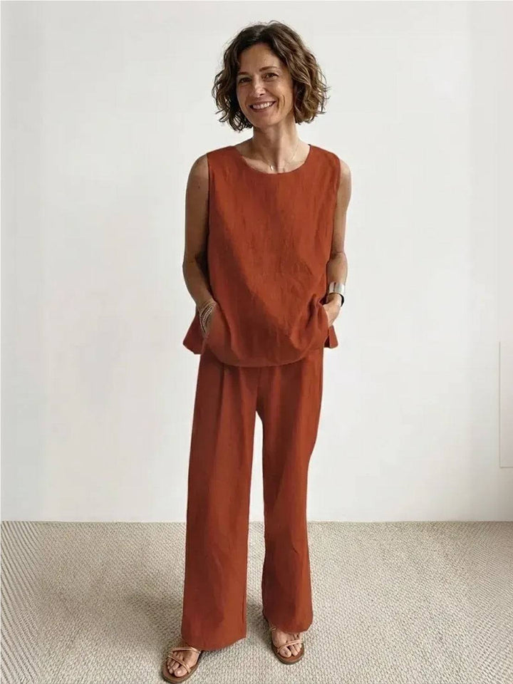 Female model showcasing a coordinated sleeveless top and trousers with a relaxed look.