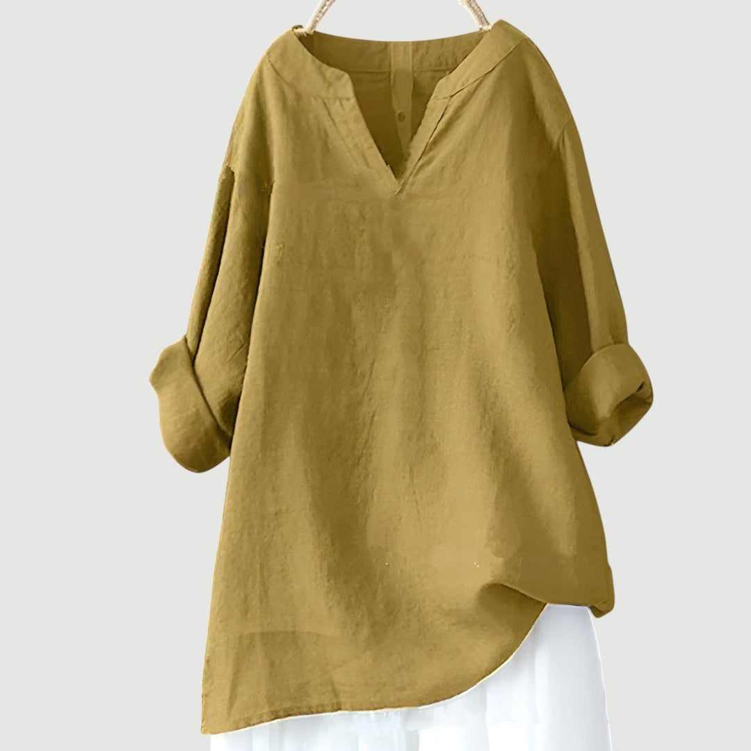 A flowy sleeveless top with a relaxed shape on a plain background.