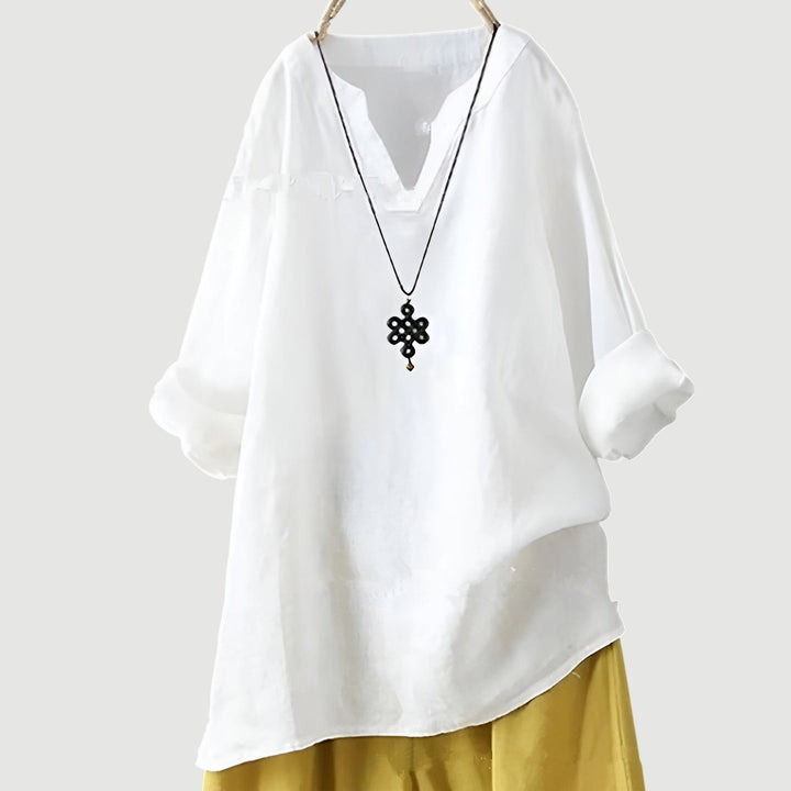 A casual sleeveless top paired with a relaxed silhouette.
