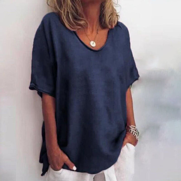 Female wearing a loose blouse designed for comfortable daily styling.