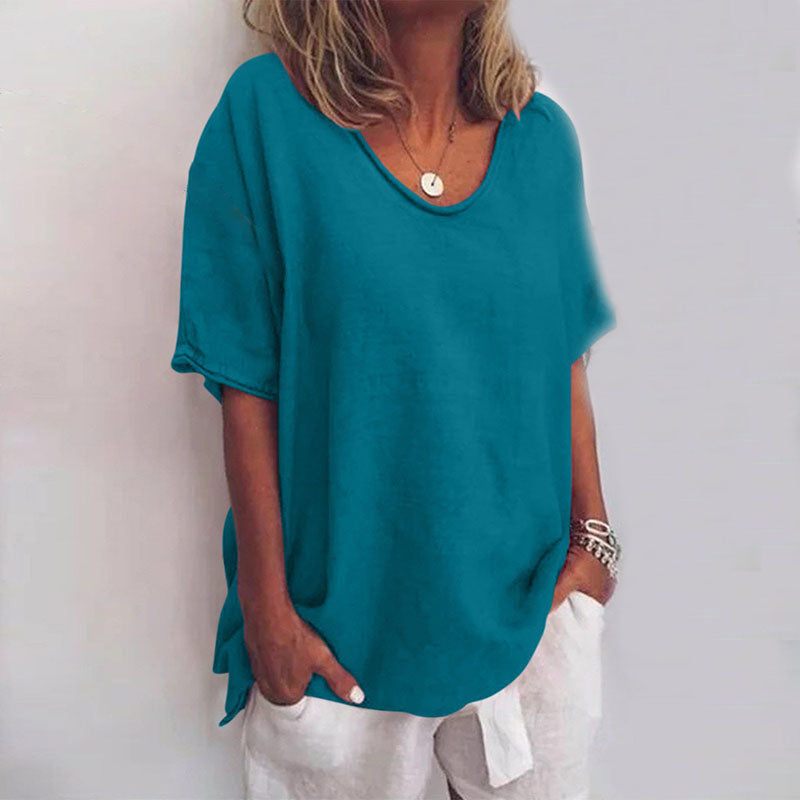 Woman wearing a casual blouse with a flowing fit and soft appearance.