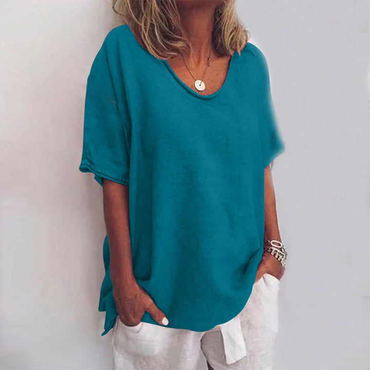 Woman wearing a casual blouse with a flowing fit and soft appearance.