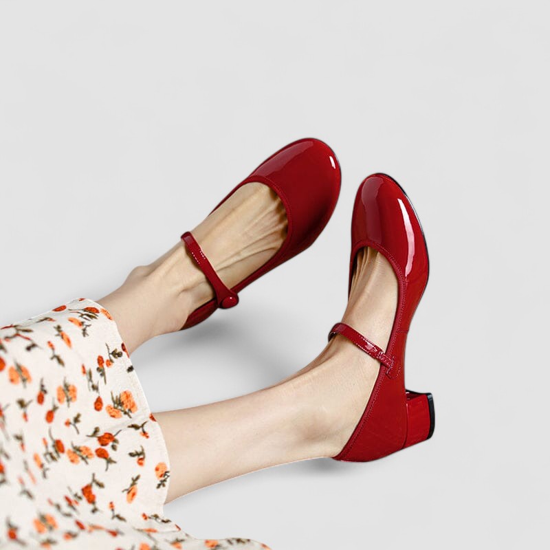 Elegant women’s slip-on shoes displayed on a plain background.