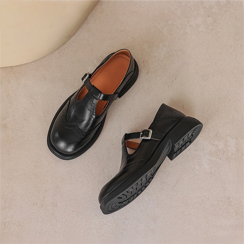 Classic T-strap footwear on a plain background.