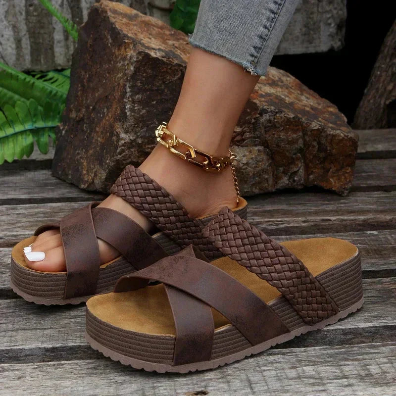 Female modelling breathable walking sandals with flexible sole support.