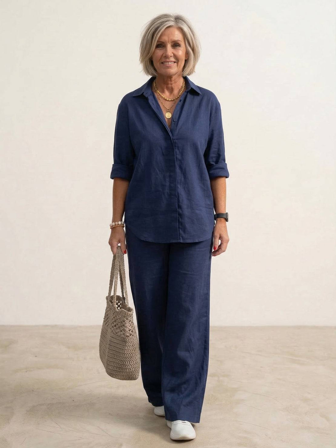 Female model wearing an oversized shirt and wide-leg trousers co-ord set against a plain background.
