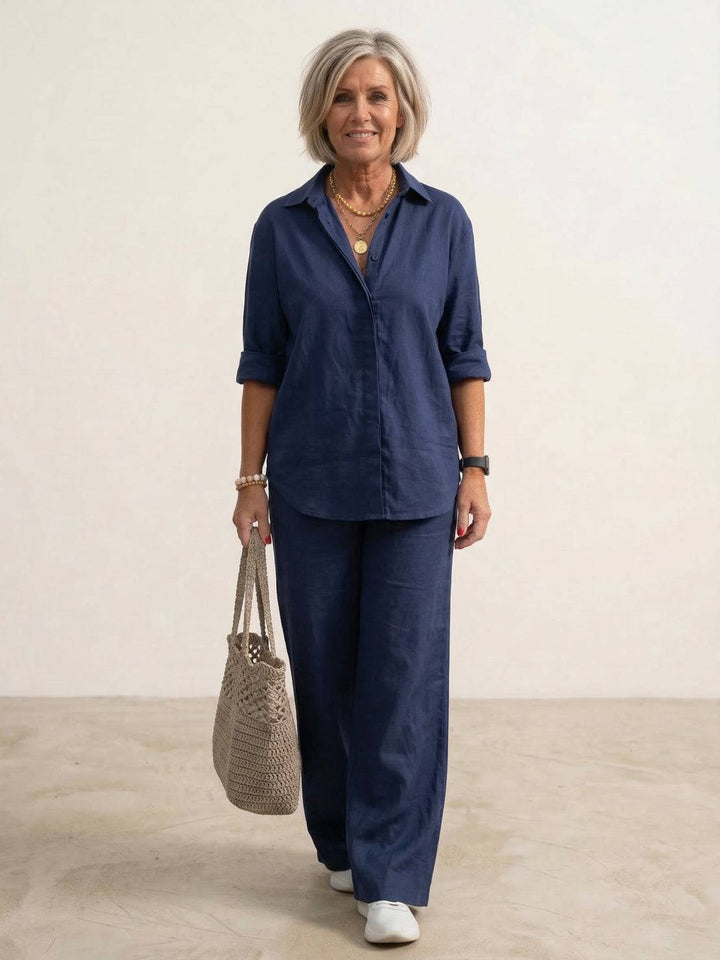 Female model wearing an oversized shirt and wide-leg trousers co-ord set against a plain background.